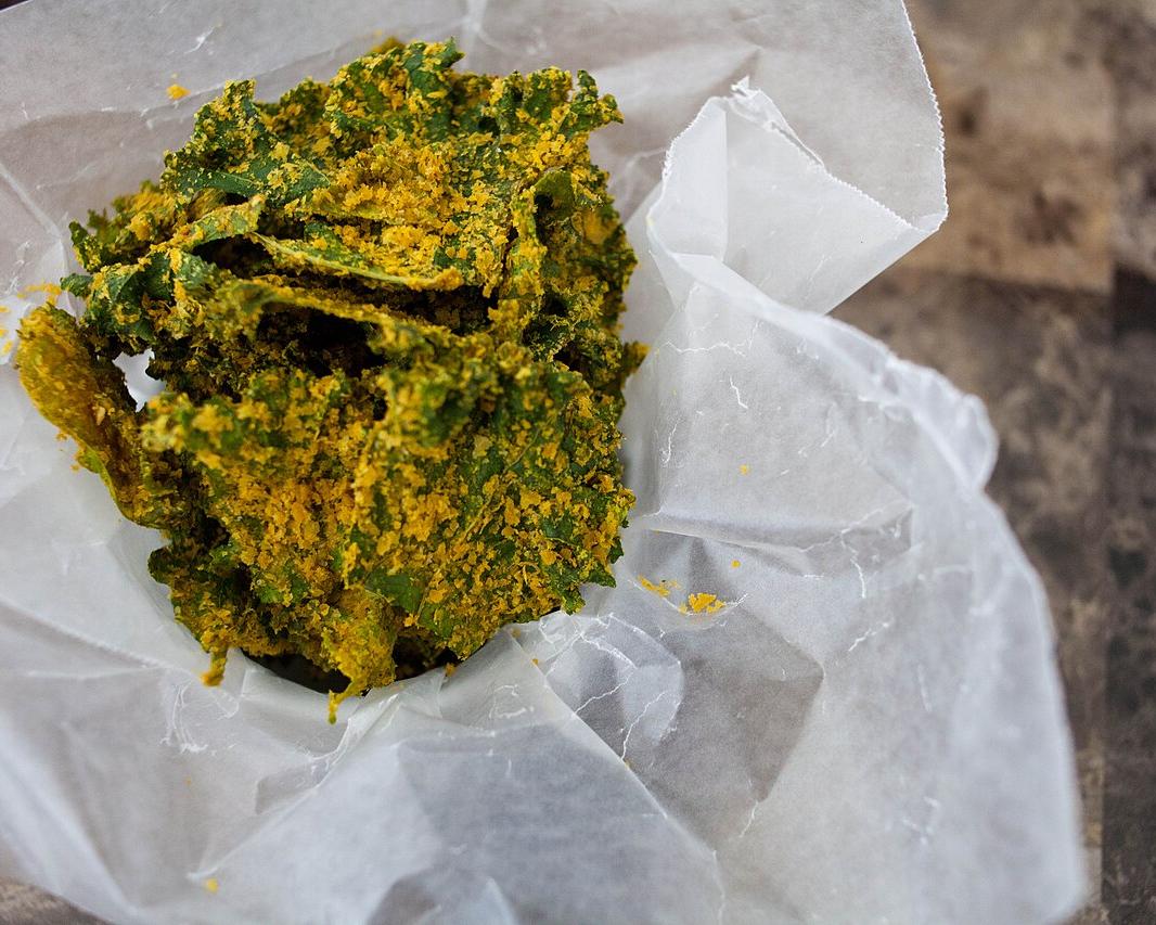 Baked kale chips seasoned with nutritional yeast and spices