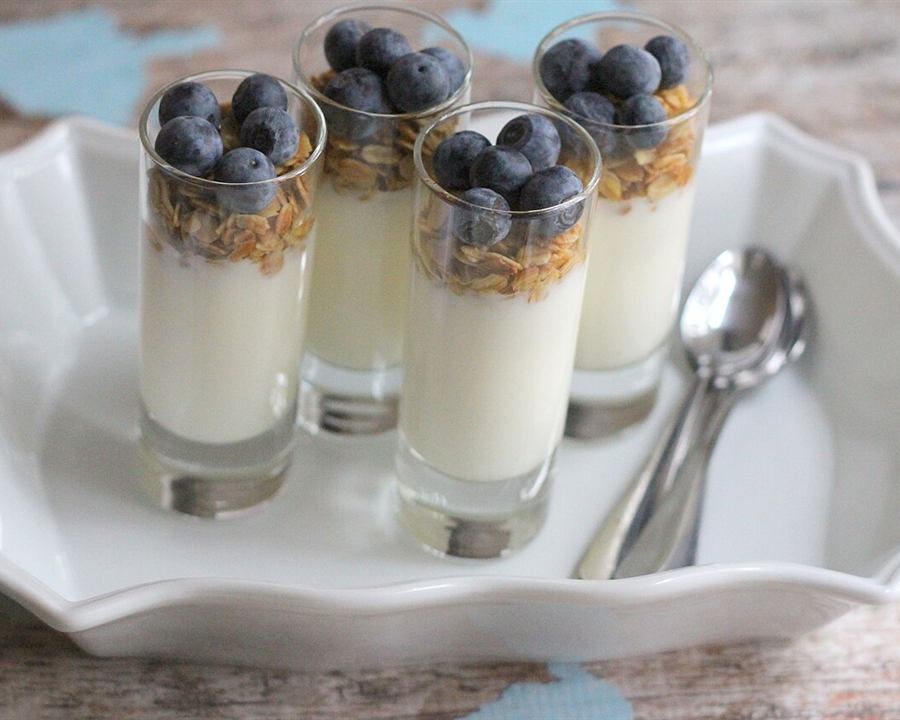 Serving inspiration: Yogurt parfaits with granola and blueberries in small glasses. Not verified as this exact recipe.