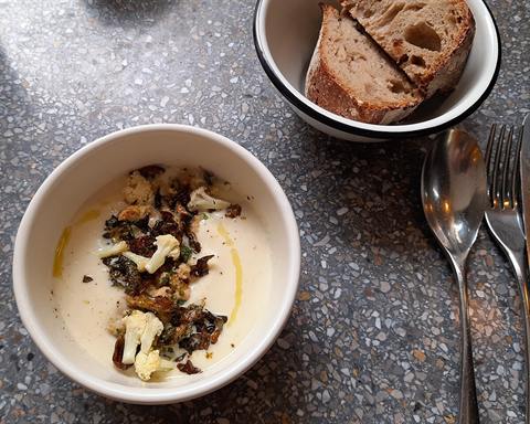 Serving inspiration: A bowl of cream of cauliflower soup topped with crisp fried leaves. Not verified as this exact recipe.