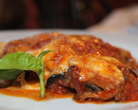 Serving inspiration: Baked aubergine (eggplant) with tomato sauce and melted cheese, with a basil leaf. Not verified as this exact recipe.