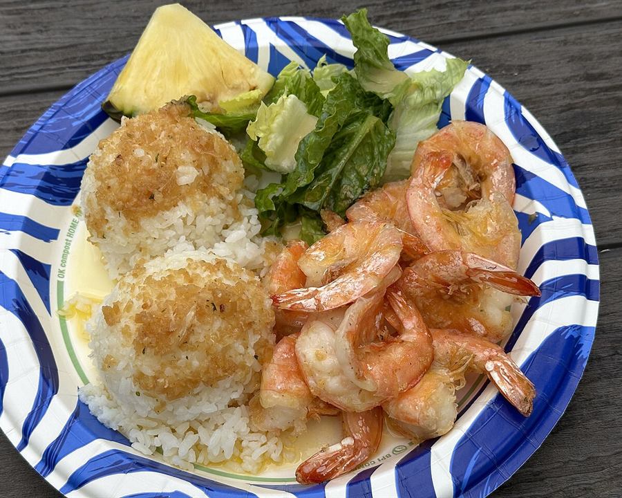 Garlic butter shrimp served with rice and a green salad