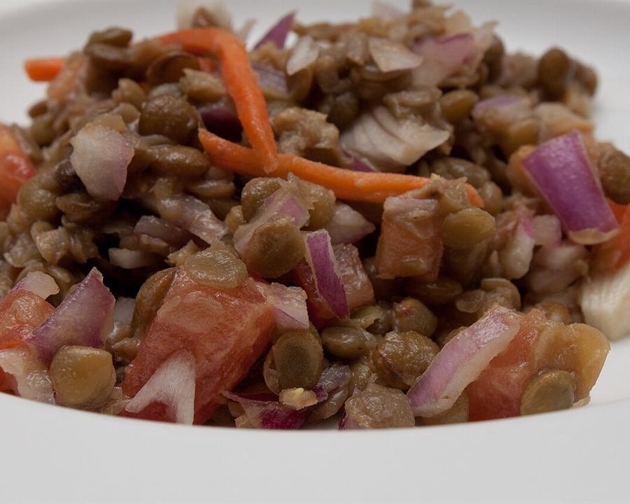 Lentil salad with diced tomato, red onion and carrot