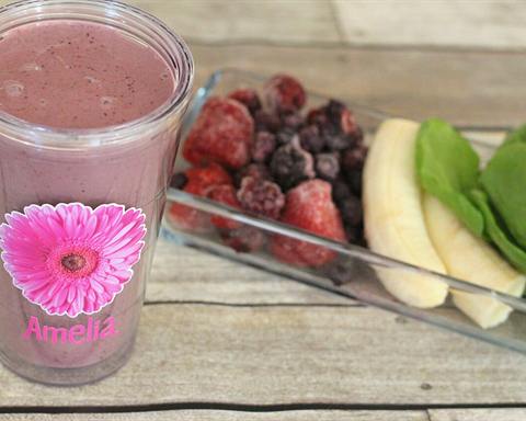Serving inspiration: A fruit and Greek yogurt smoothie in a glass, with frozen berries, banana and spinach beside it. Not verified as this exact recipe.