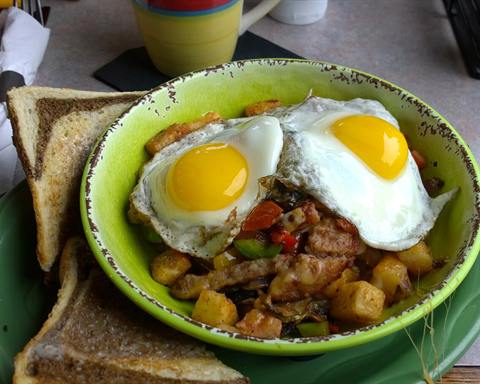 Serving inspiration: A breakfast hash of diced potato and peppers topped with two fried eggs, with toast. Not verified as this exact recipe.